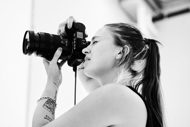 Woman with a Leica SL3 in Hands