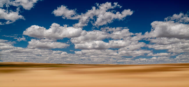 desert with blue cloudy sky