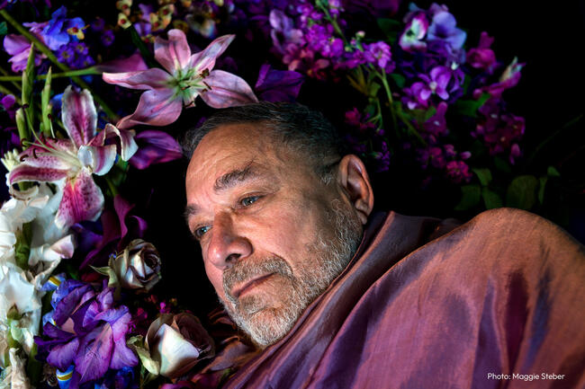 Portrait of a man in a field of flowers