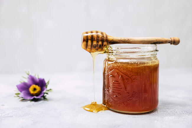 Honey jar with honey spoon