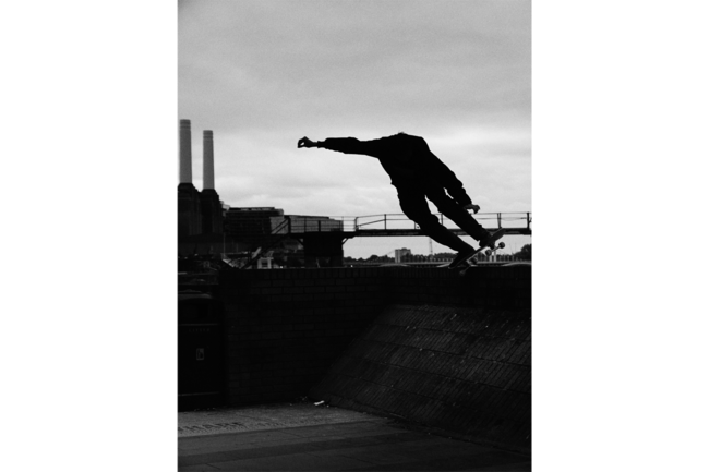 Black and white shot, capturing a skater in action.