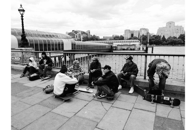 A group of young people in front of the Thames