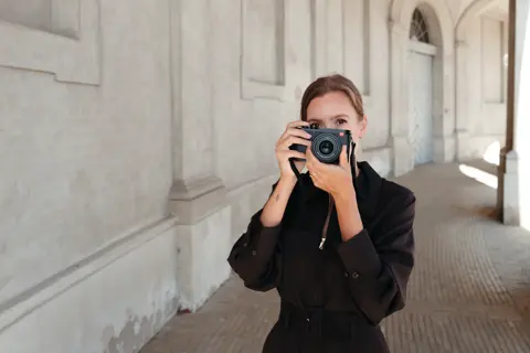 Portrait of Anna Landstedt photographing with Leica Q3 43
