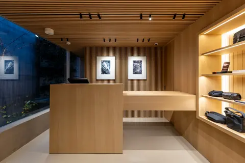 Shelf with camera bags inside Leica Store Tokyo Omotesando.