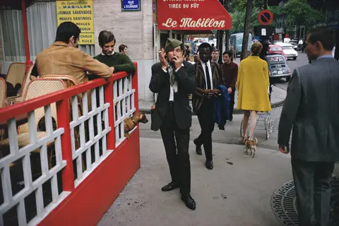 man on a street with a telephone