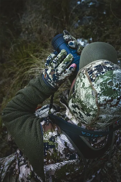 Hunter is looking through his Leica Calonox View