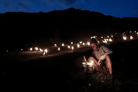 A man kindling the fire