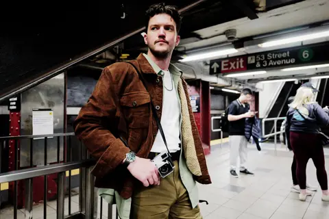 Man with a leica camera and a leica watch