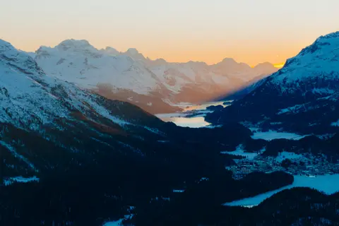 Mountains at sunset with snow