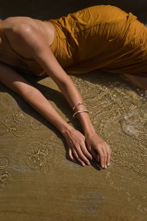 model laying on the ground 