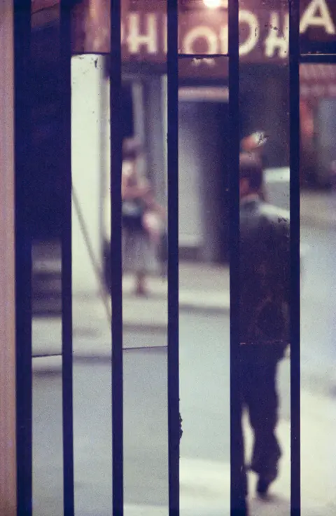 Saul Leiter photo of man in a mirrow
