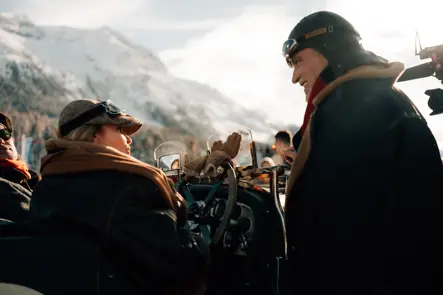 a lot of people at a racing event in a snowy landscape