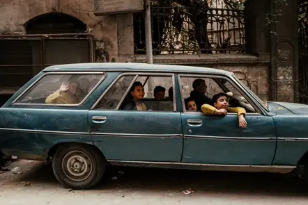 people sitting in car