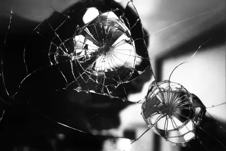Black-and-white photo of a broken mirror