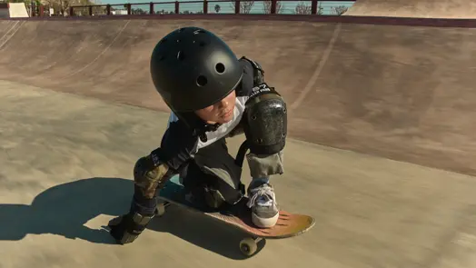 Boy on his skateboard in the skate pool