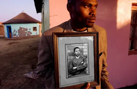 man showing picture frame portrait