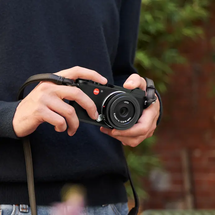 Man holding a Leica Camera in his hand