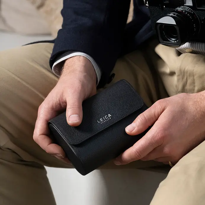 Leica Film Rolls and Sim Card Holder in hands