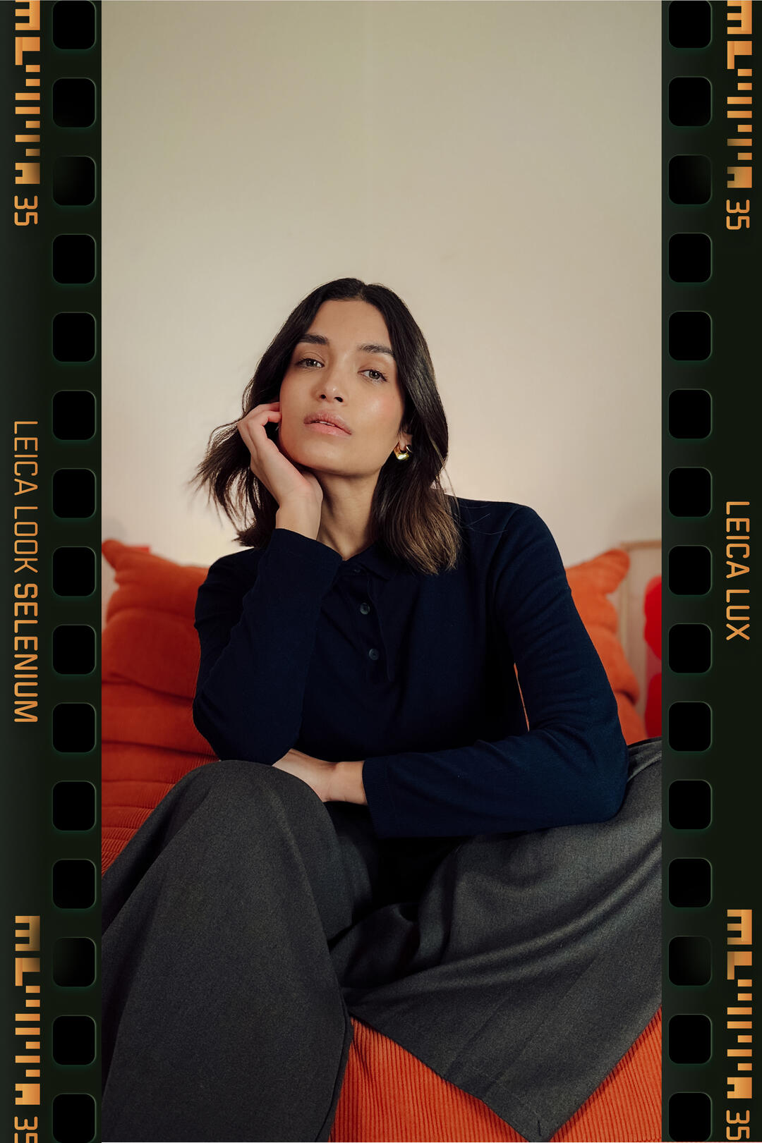 Woman sitting on a orange couch