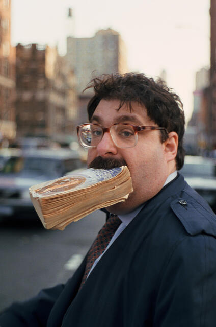 Man with a book in his mouth