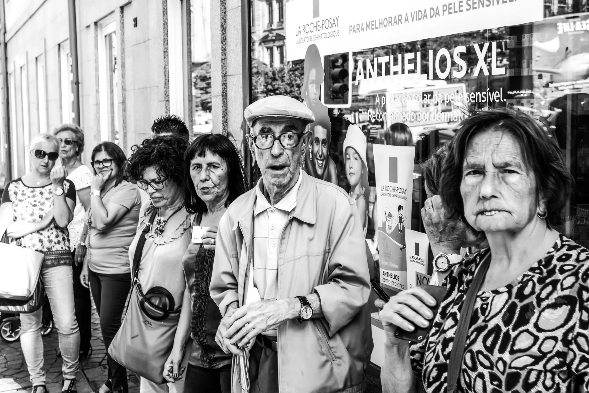 Man with glasses in a crowd