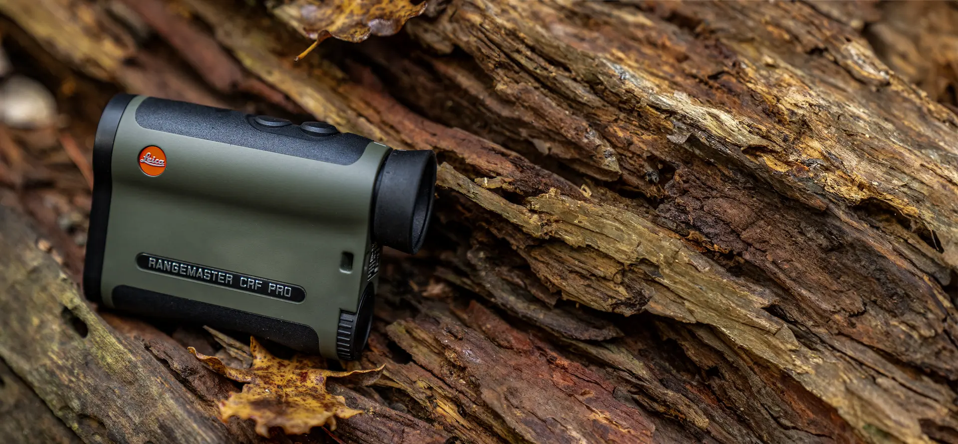 leica-rangemaster-crf-pro-lying-on-a-tree-trunk