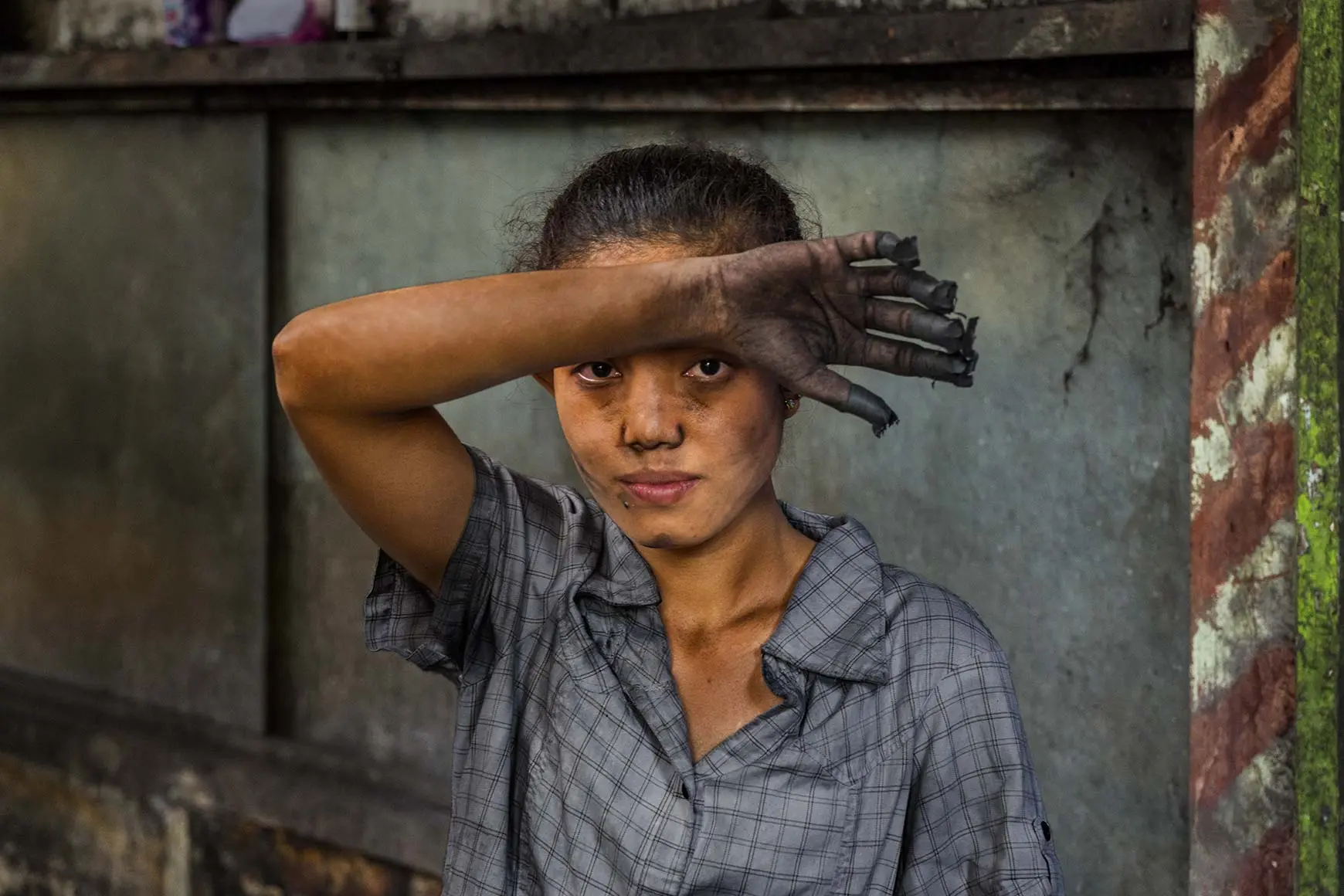 sad woman with dirty hands on her forehead