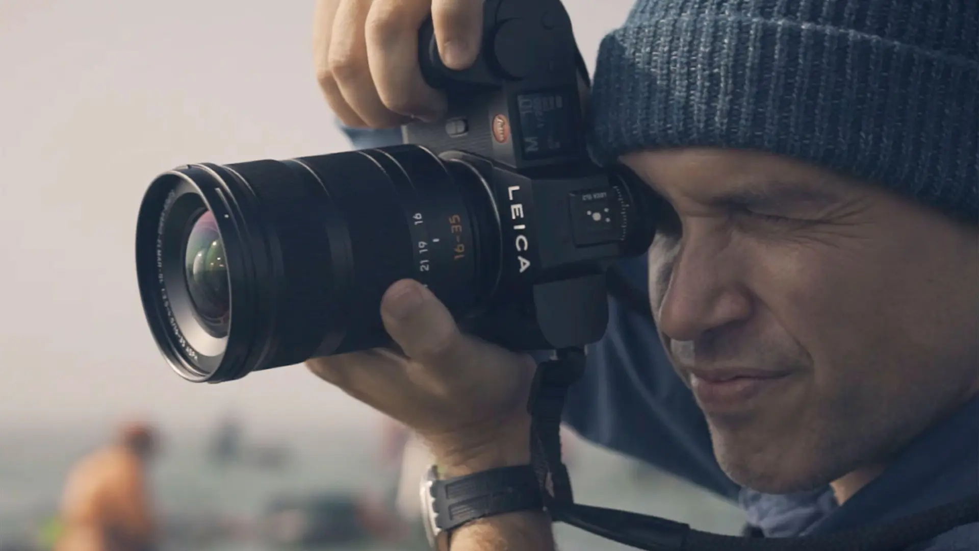 Close-up of a man taking a picture.