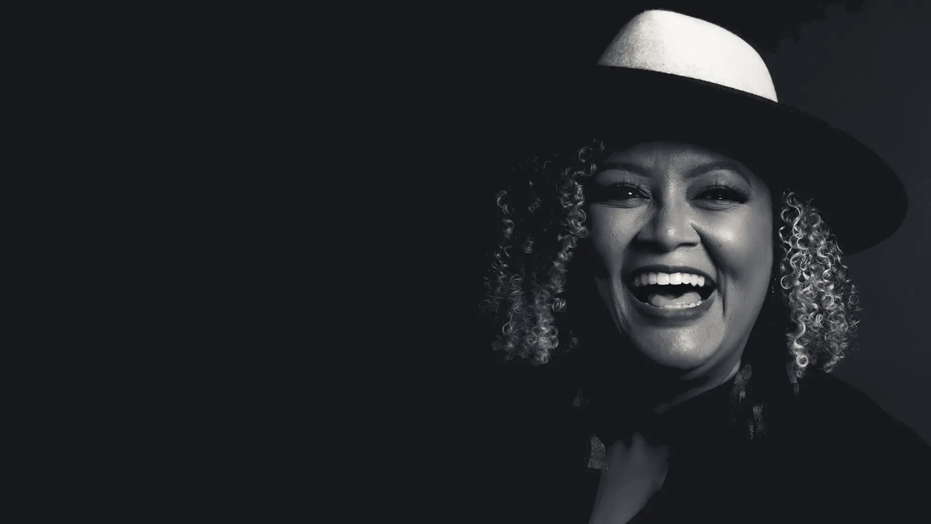 Portrait of a smiling woman wearing a hat