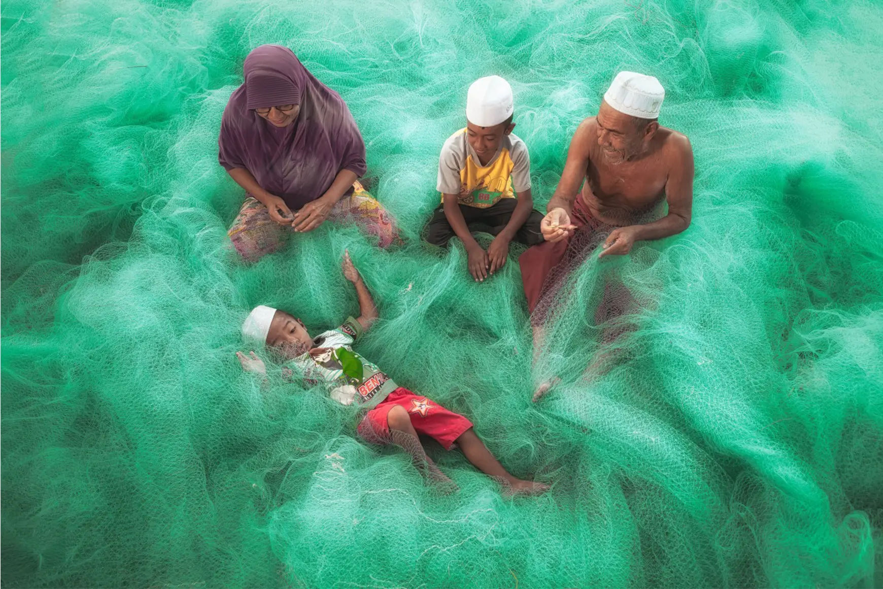 Family lies in a fishing net