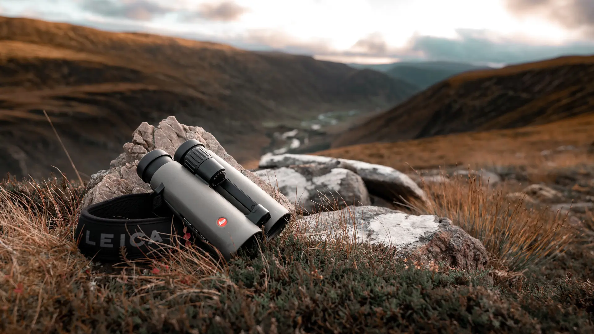 Leica-Noctivid-binoculars-lying-on-a-stone-in-the-Scottish-Highlands