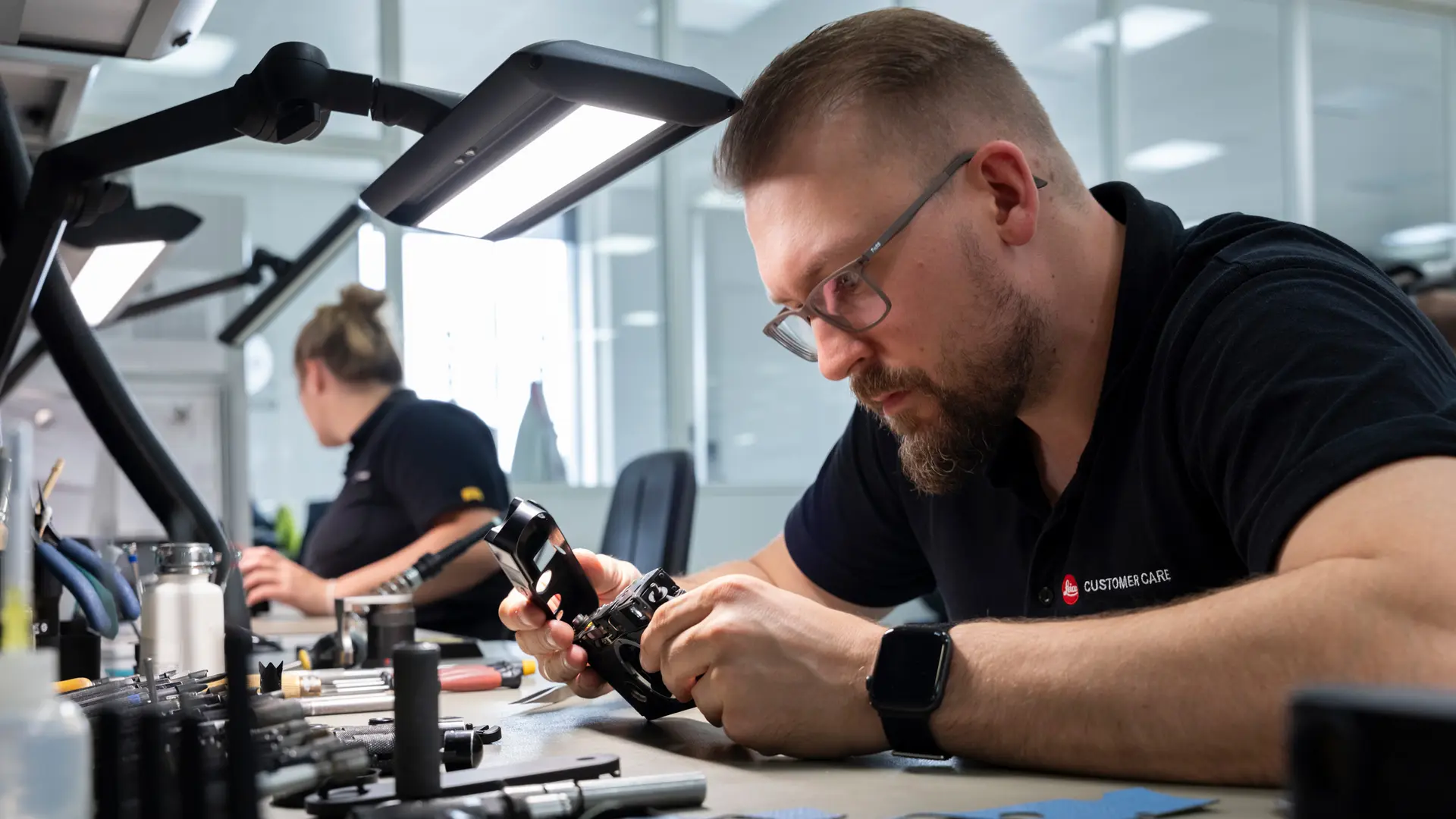 Man repairs a Leica Camera