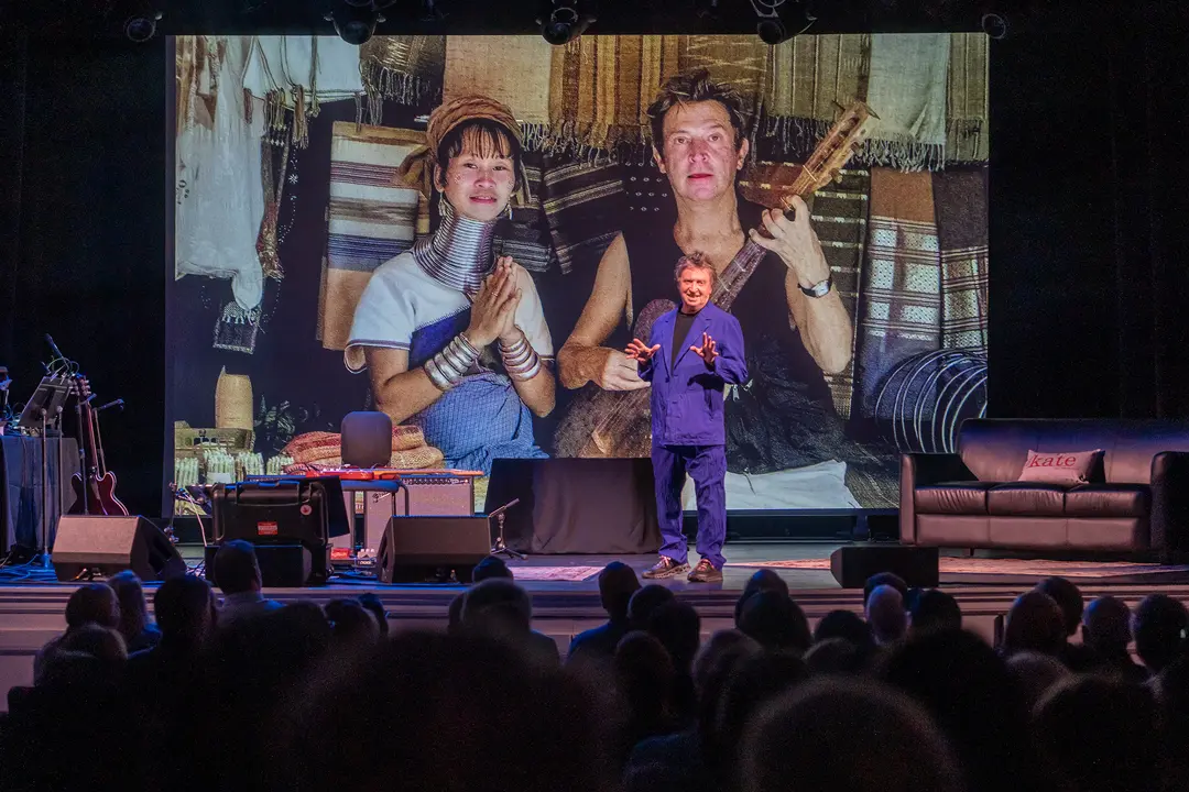 A Singer and a photographer Andy Summers is on the stage.