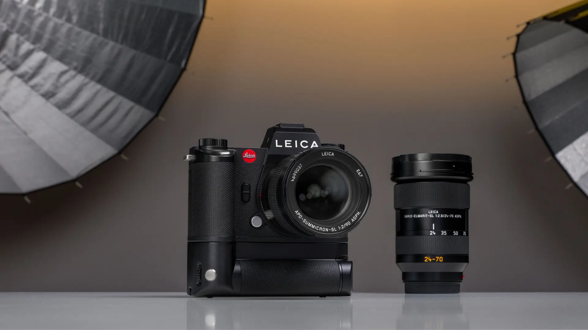 A Leica camera placed on a table in a photography studio setting