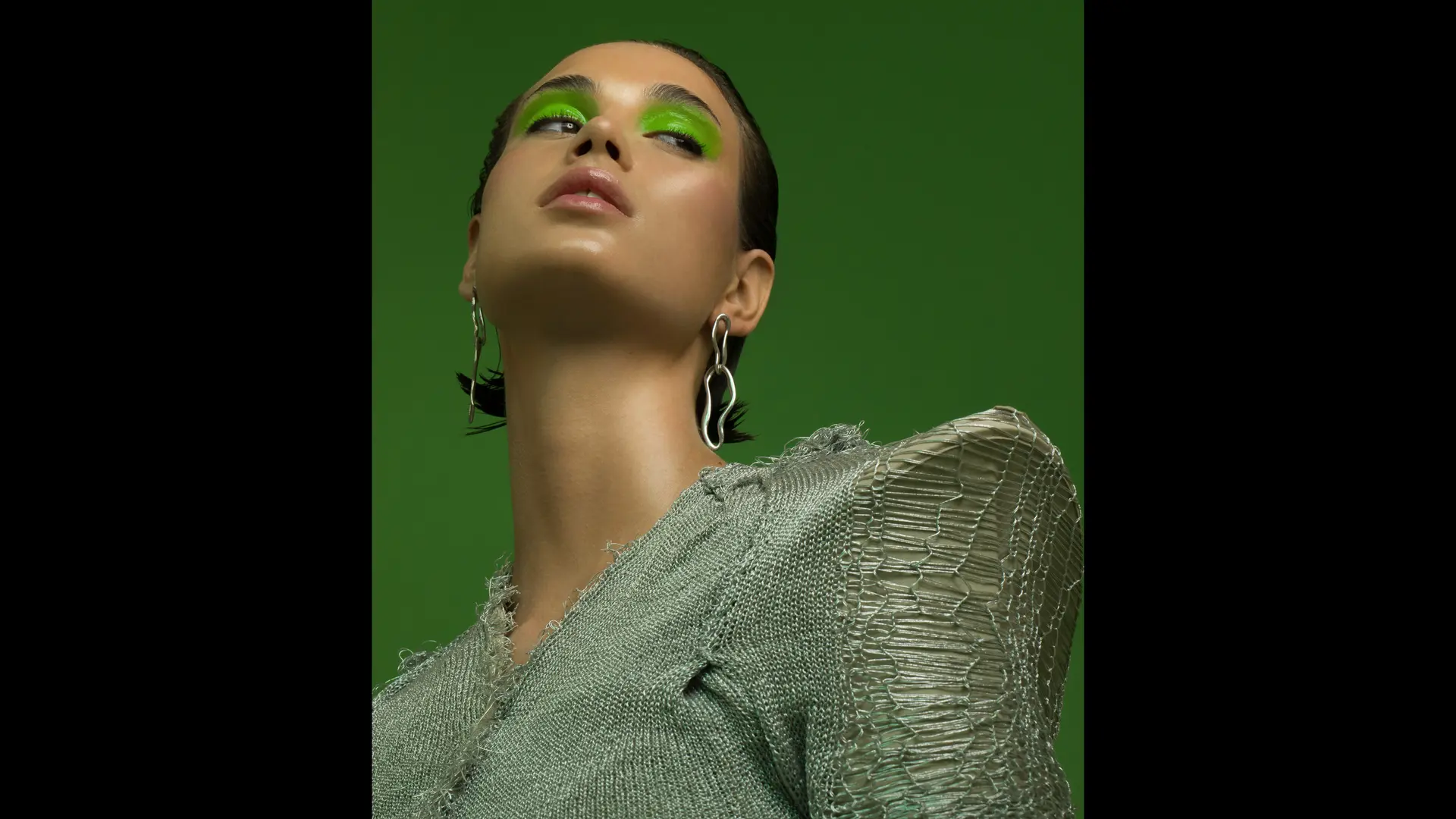 Model in front of green background