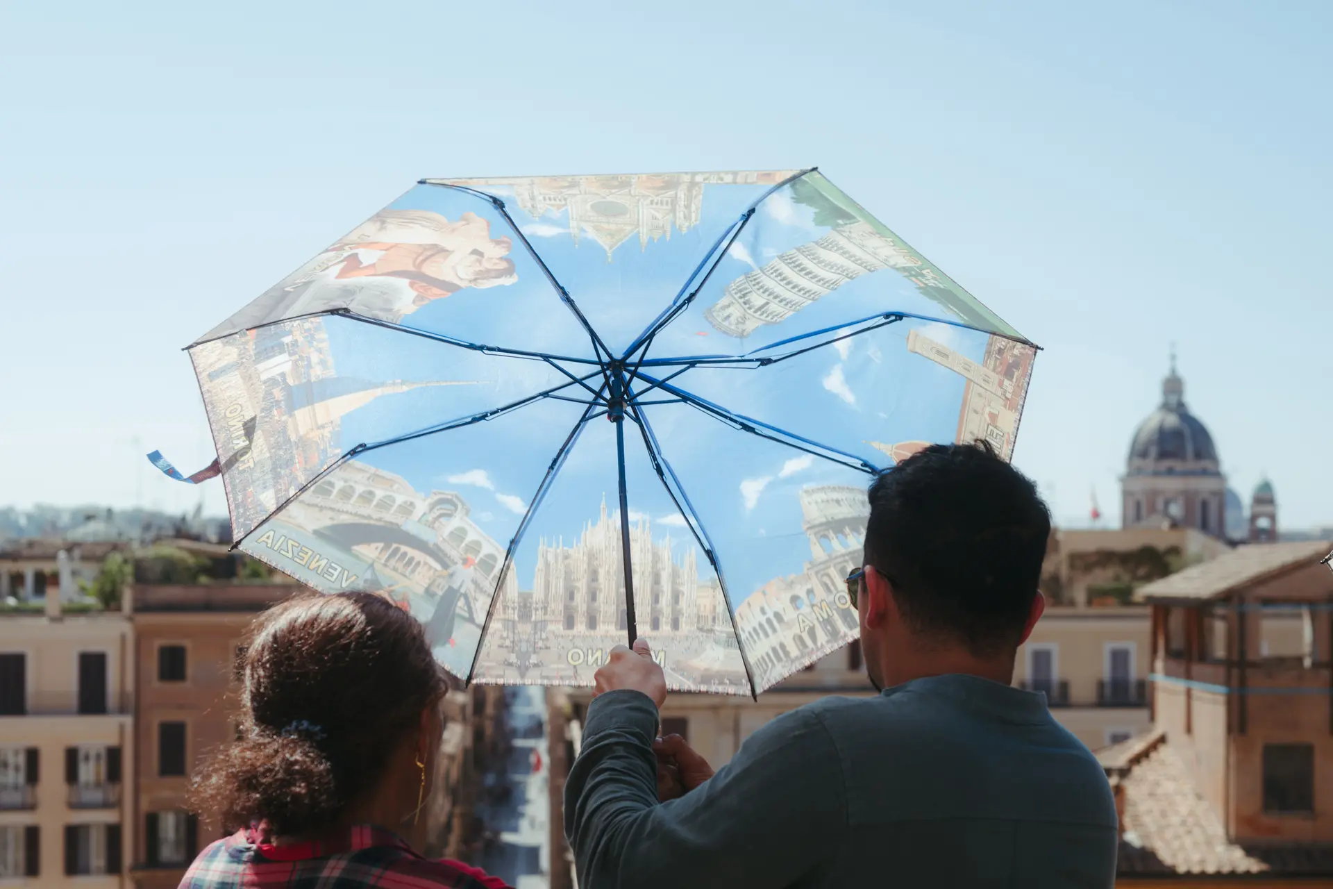 Man uses umbrella as parasol
