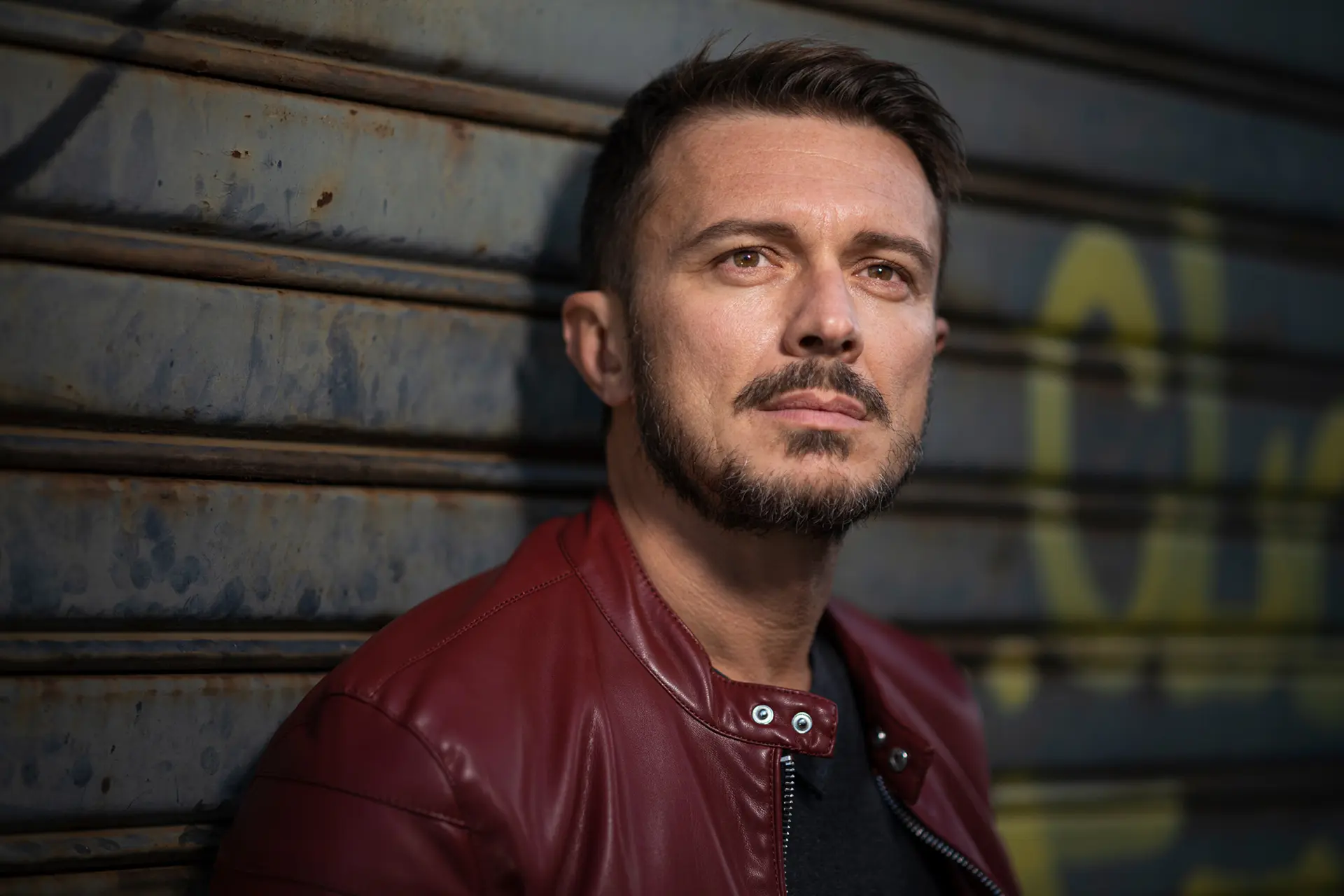 Man in front of a wall