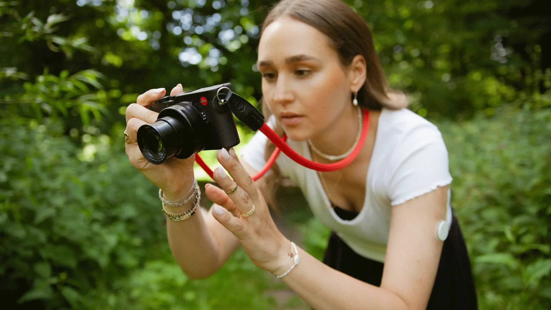 A woman taking a picture in the nature.