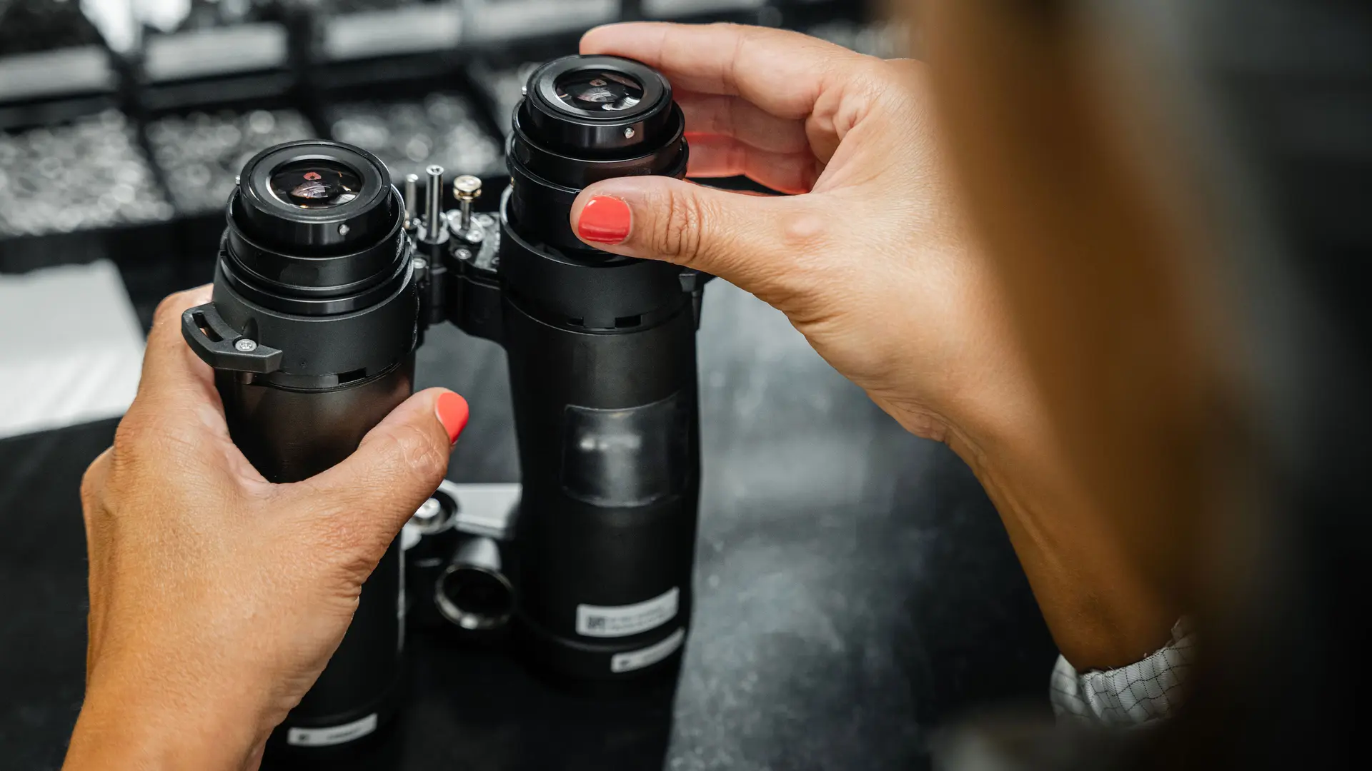 A worker making parts for the Leica binoculars