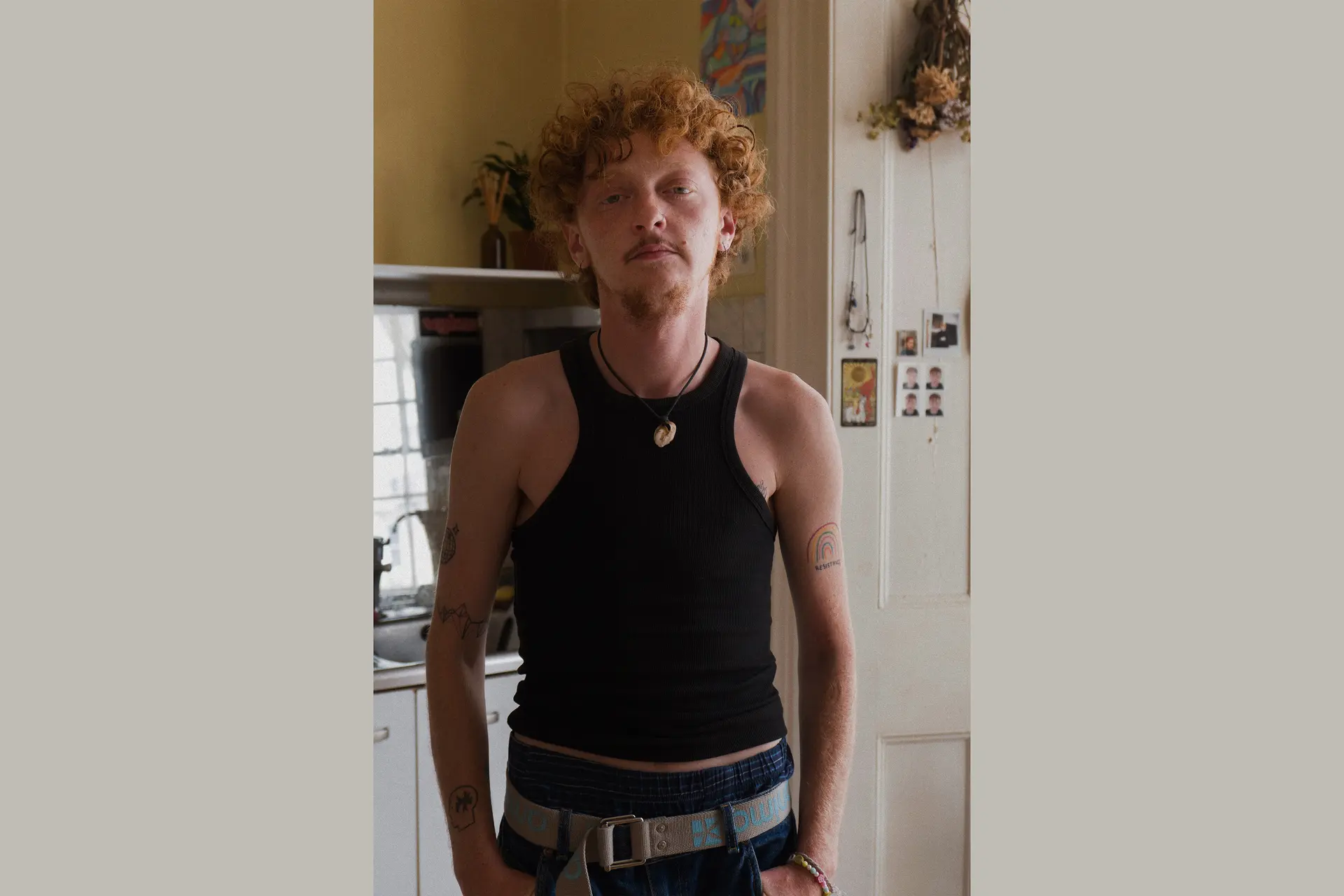 Man with curly red hair standing in a kitchen