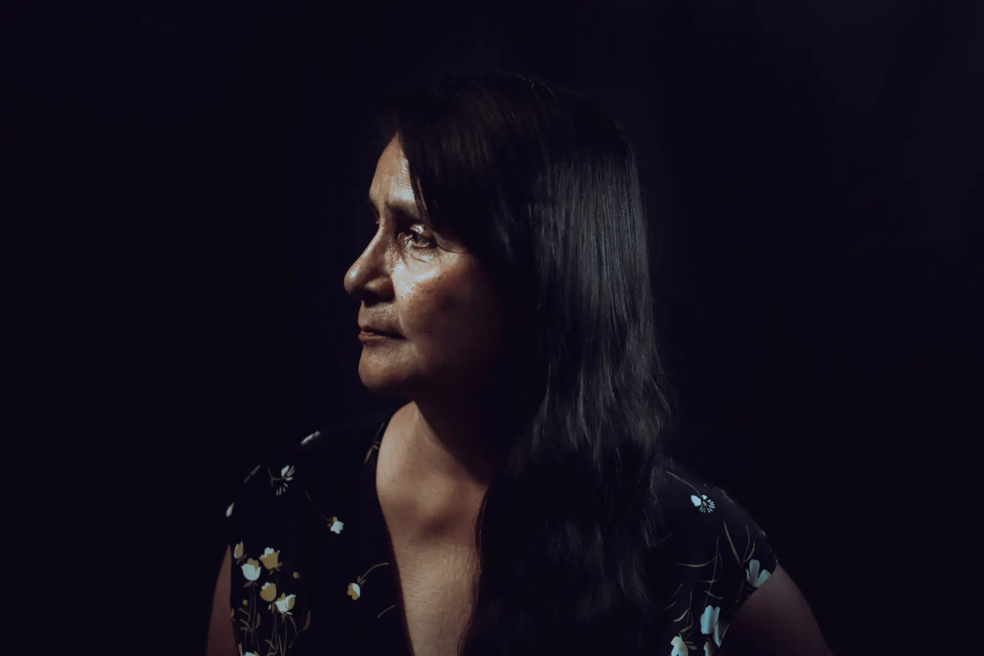 Woman in front of a black background