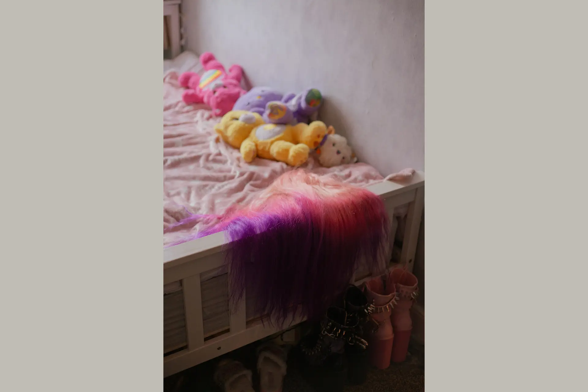 Bed with the lucky bears lying on it