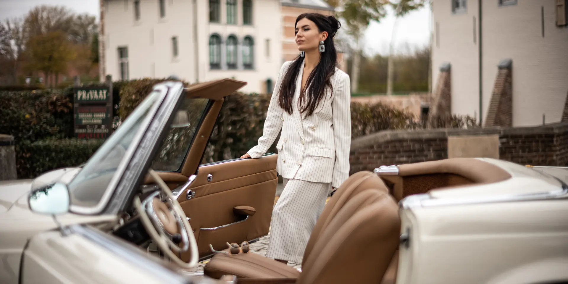 Woman with a classic car 