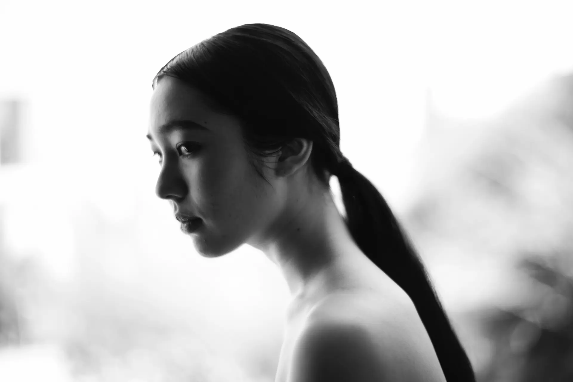 An Asian woman in black 6 white