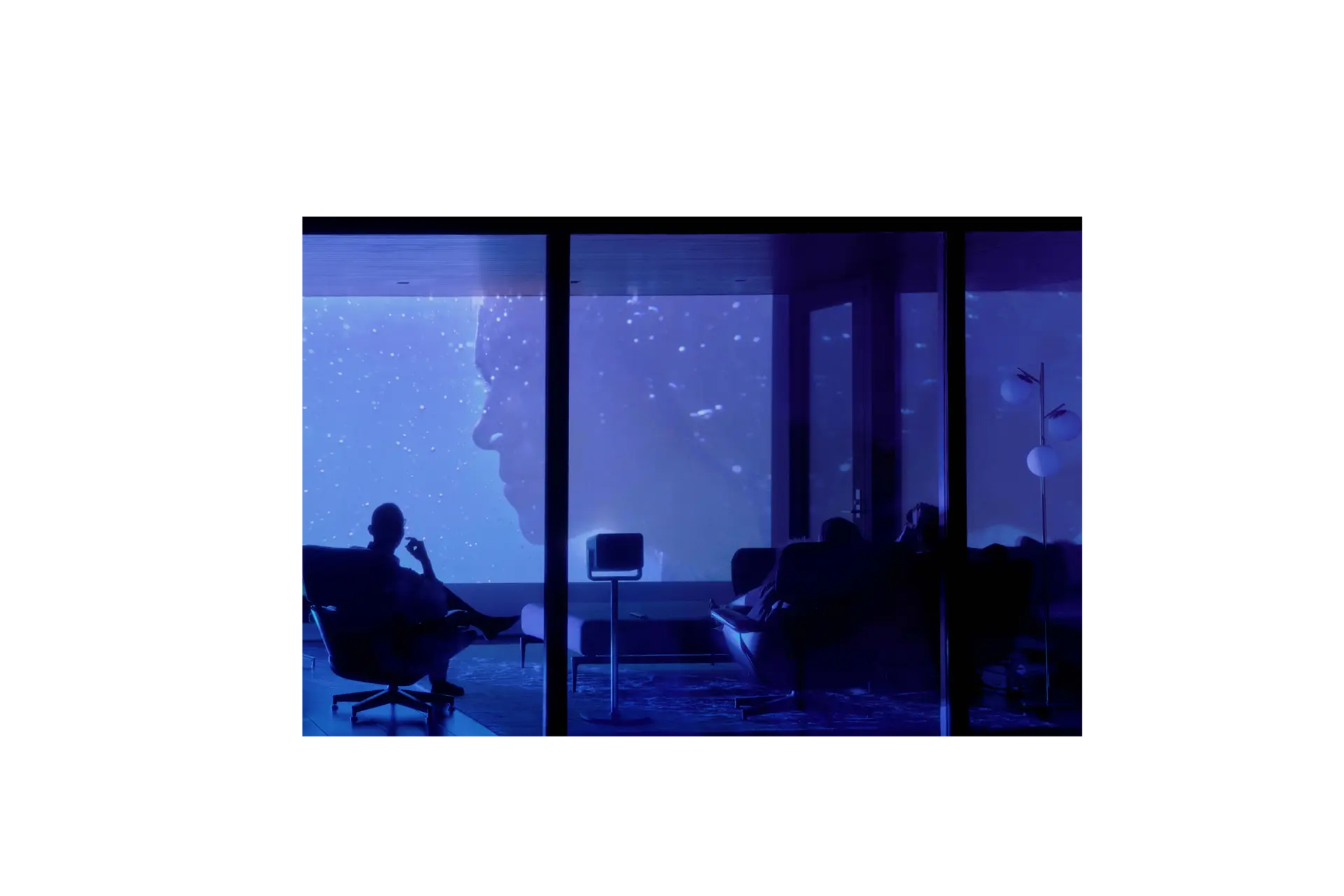 Man in Armchair watches Movie 