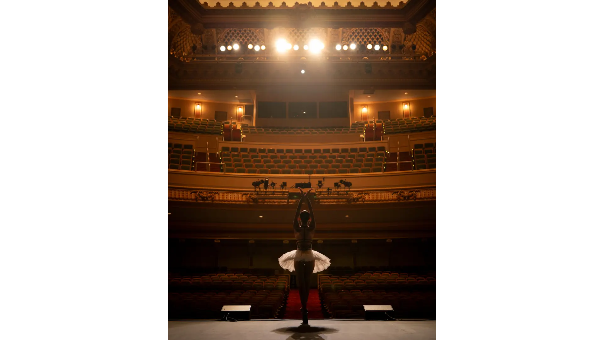 Ballet dancer on stage in an empty theater