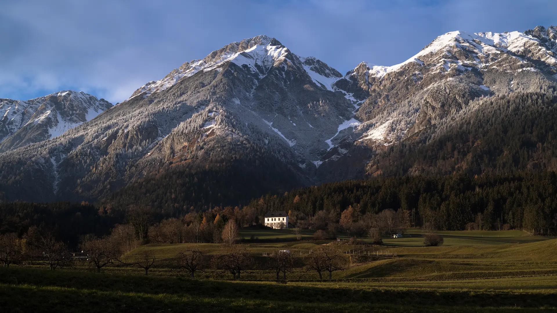 Mountain panorama with white peaks and blue sky