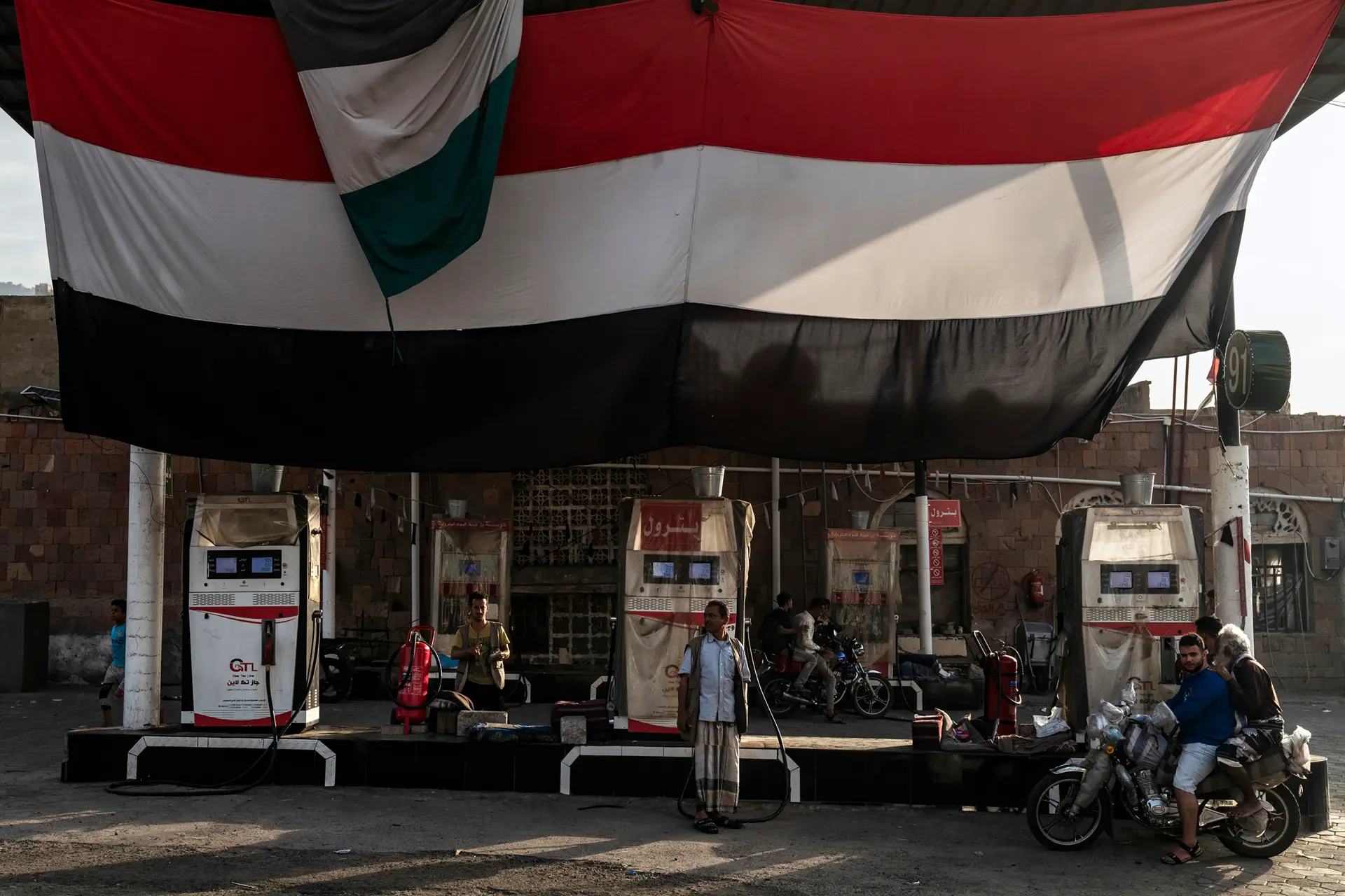Old petrol station with people