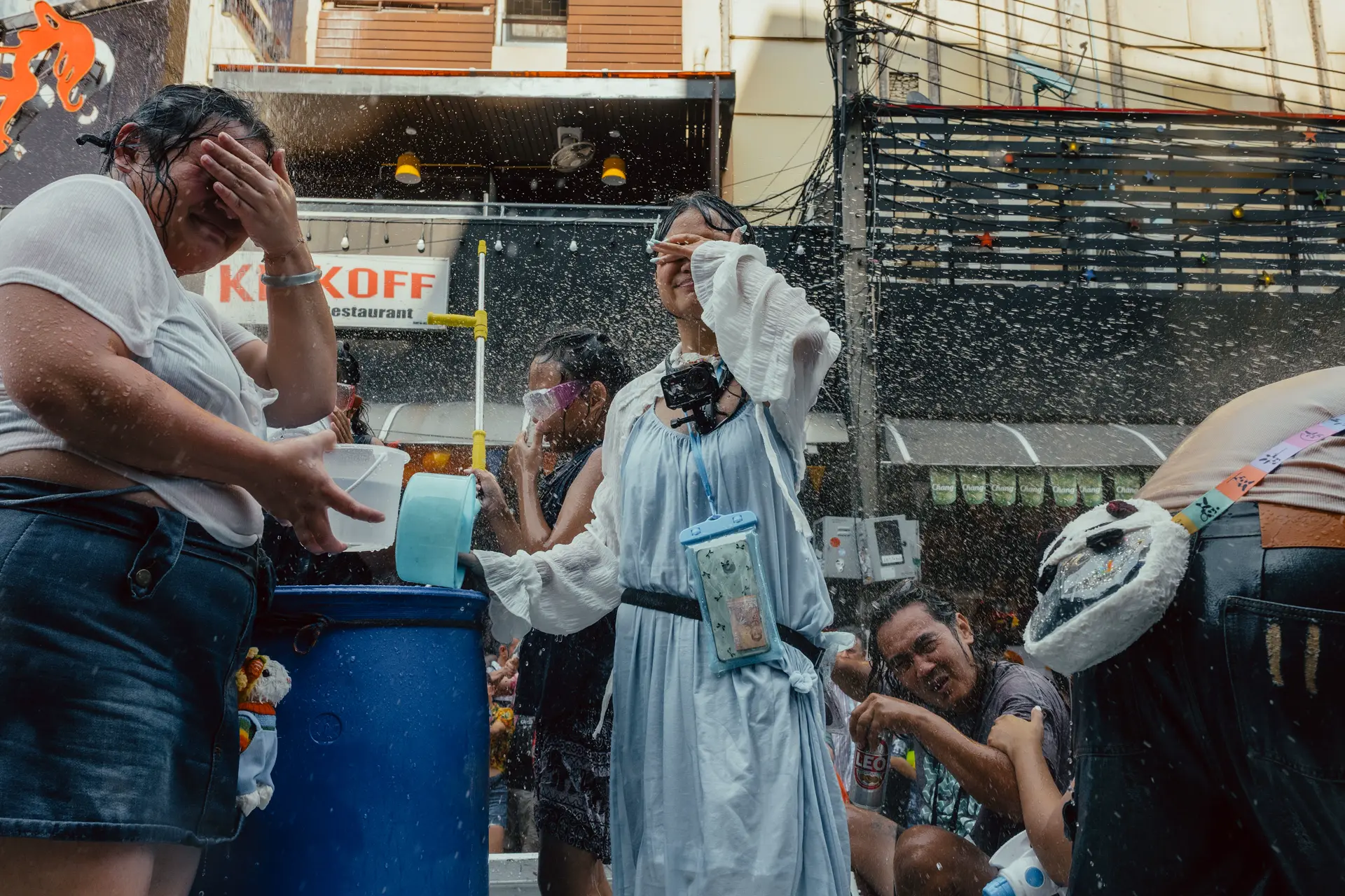 Group of people in the streets get wet