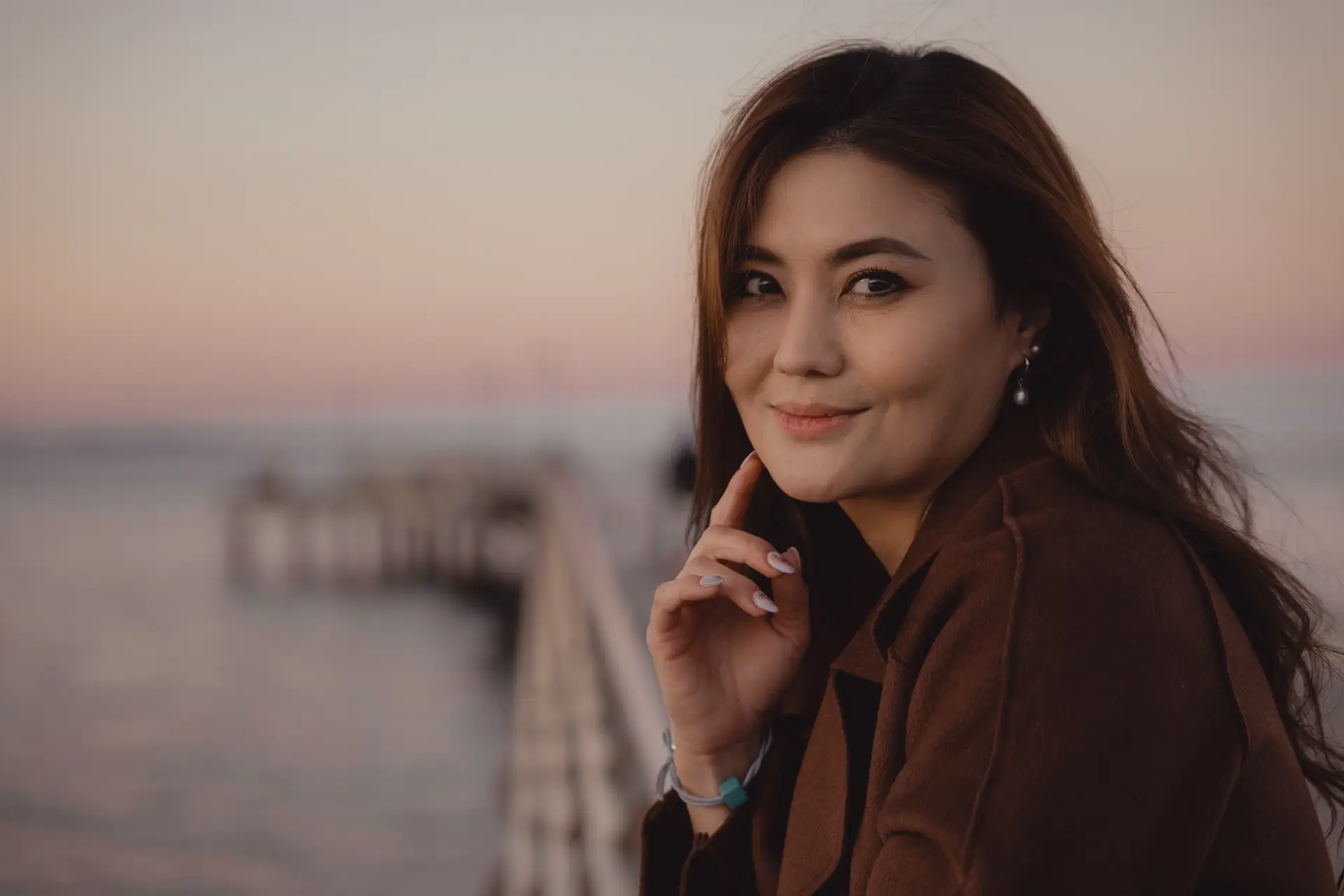 Portrait of a woman on a jetty by the lake